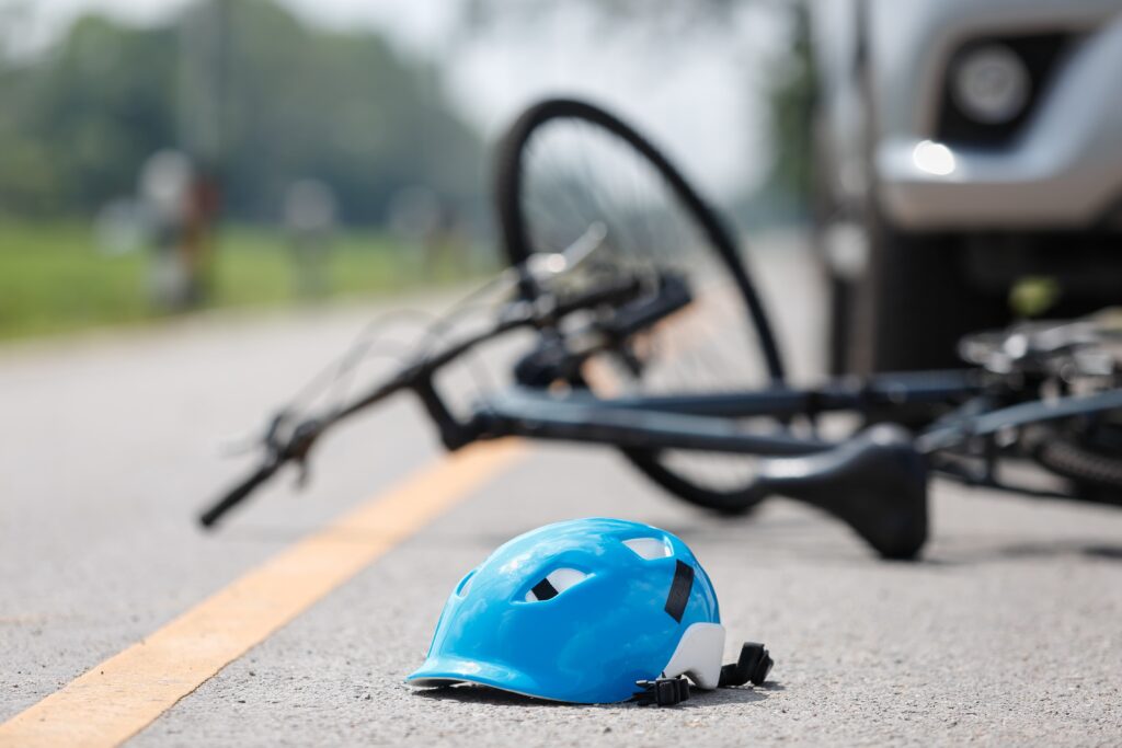 bicycle accident helmet on ground