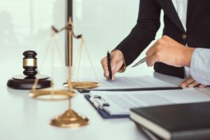 lawyer signing a document
